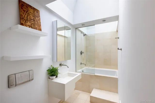 a bed room with a bed and a chair