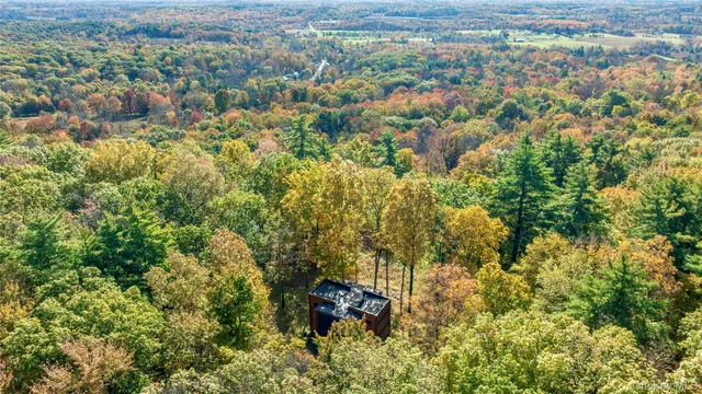 an aerial view of residential house and outdoor space