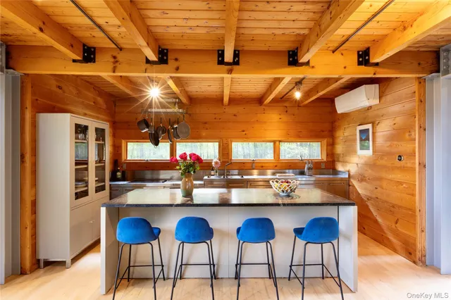 a kitchen with a granite countertop sink a stove and dishwasher
