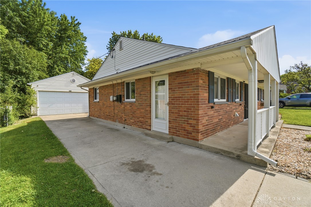 629 Storms Road Dayton, OH 45429 - Photo 50 of 51 This classic brick residence features an attached covered porch and a detached garage.