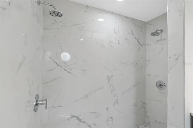 an aerial view of multiple houses with yard