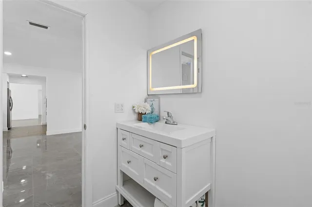 front view of a house with a tree