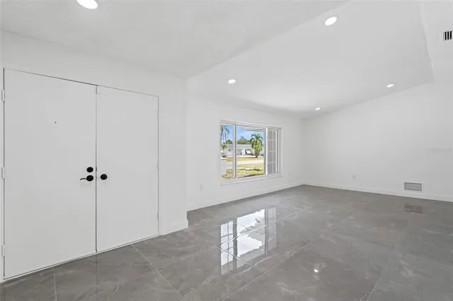 a view of an empty room with a window