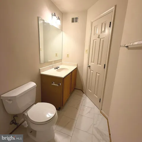 an empty room with windows and entrance