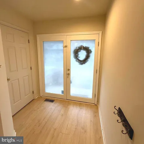 a view of outdoor space with wooden floor