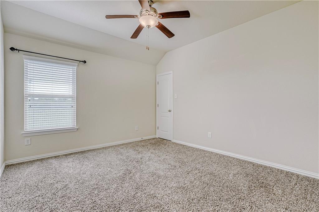 3517 Grail Hollows Road Pflugerville, TX 78660 - Photo 12 of 40 an empty room with a window and a fan