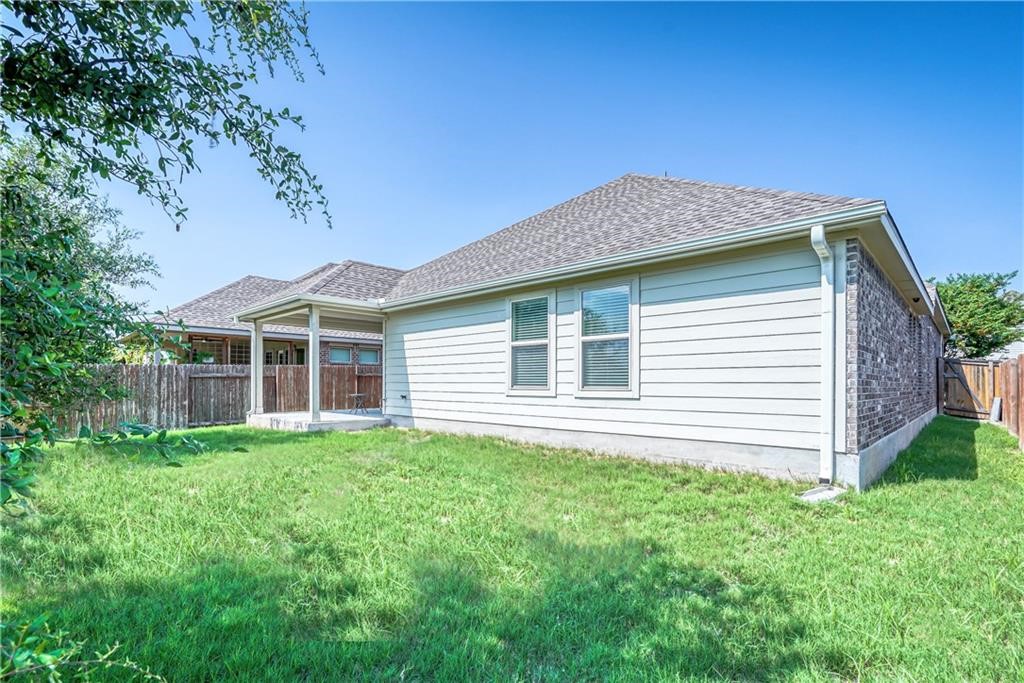 3517 Grail Hollows Road Pflugerville, TX 78660 - Photo 4 of 40 a front view of a house with a yard