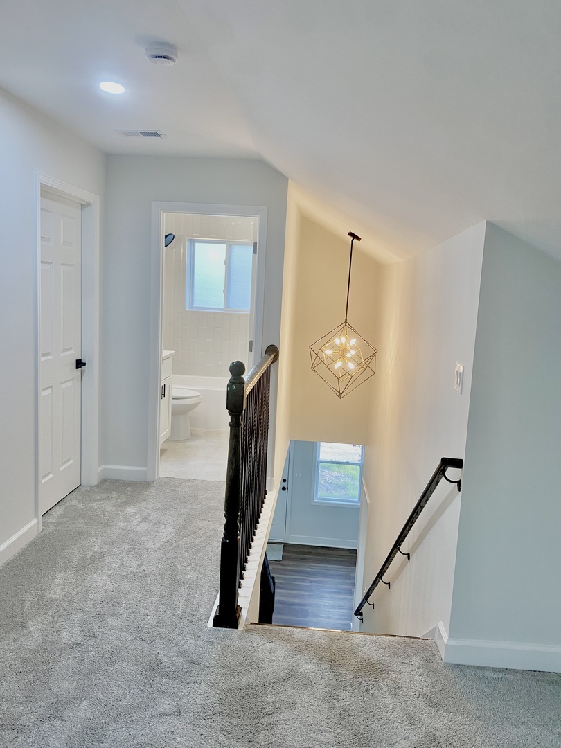 126 Prairie Street Ottawa, IL 61350 - Photo 11 of 15 a view of a hallway with paintings on the wall