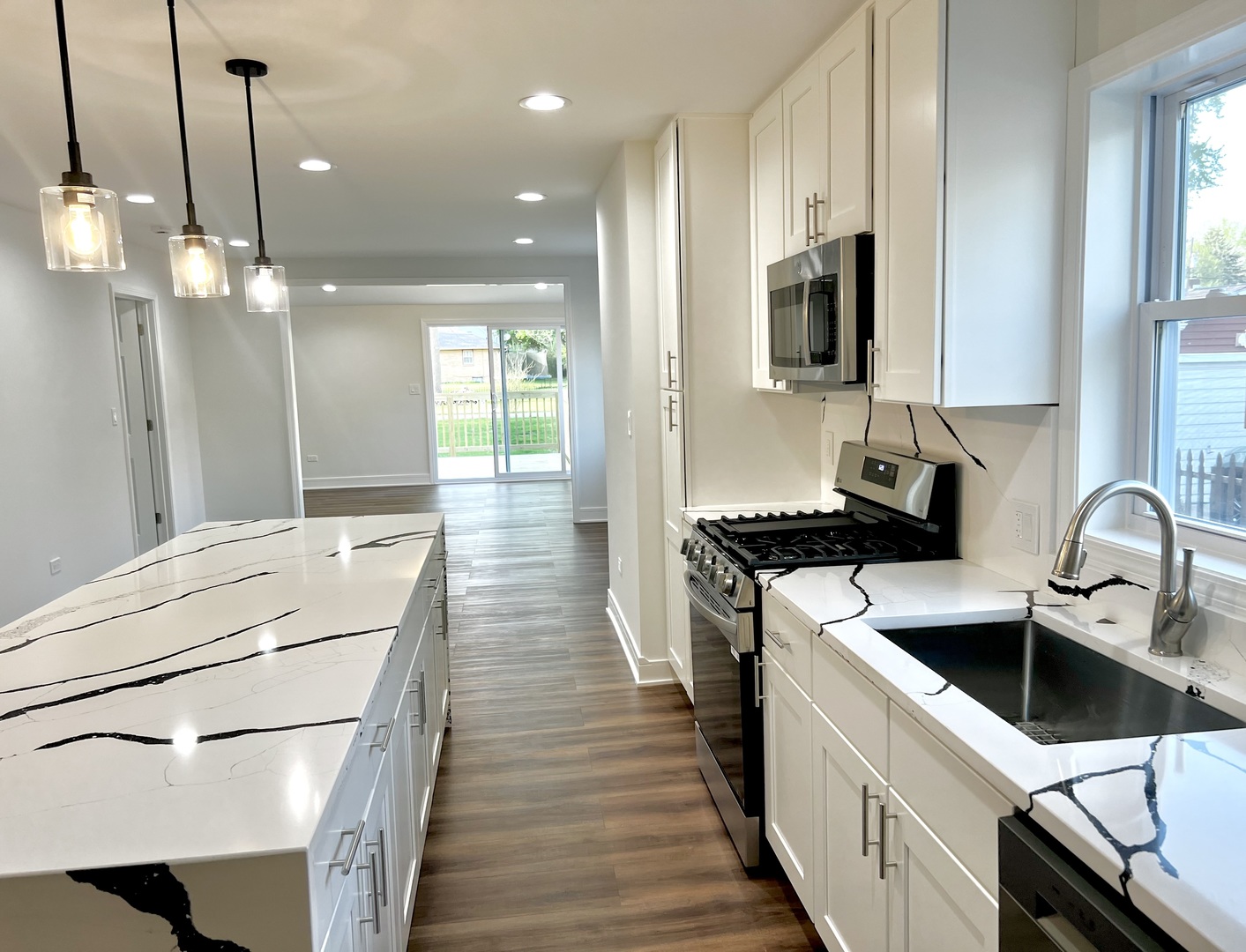 126 Prairie Street Ottawa, IL 61350 - Photo 4 of 15 a kitchen with a sink appliances and cabinets