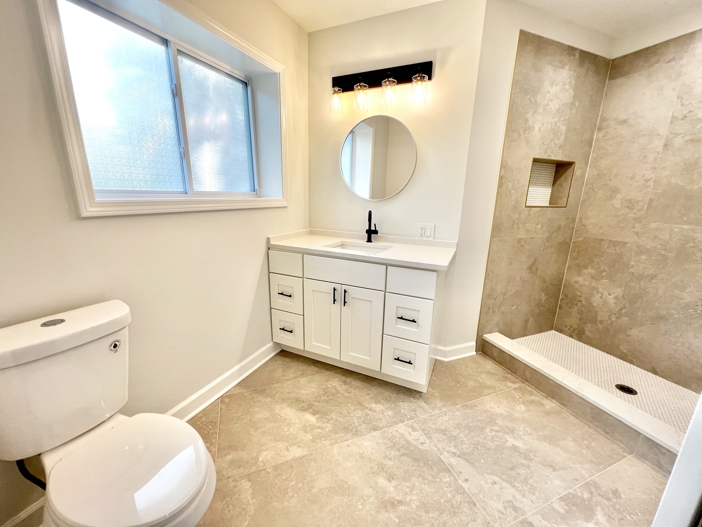 126 Prairie Street Ottawa, IL 61350 - Photo 7 of 15 a bathroom with a sink a toilet and a mirror