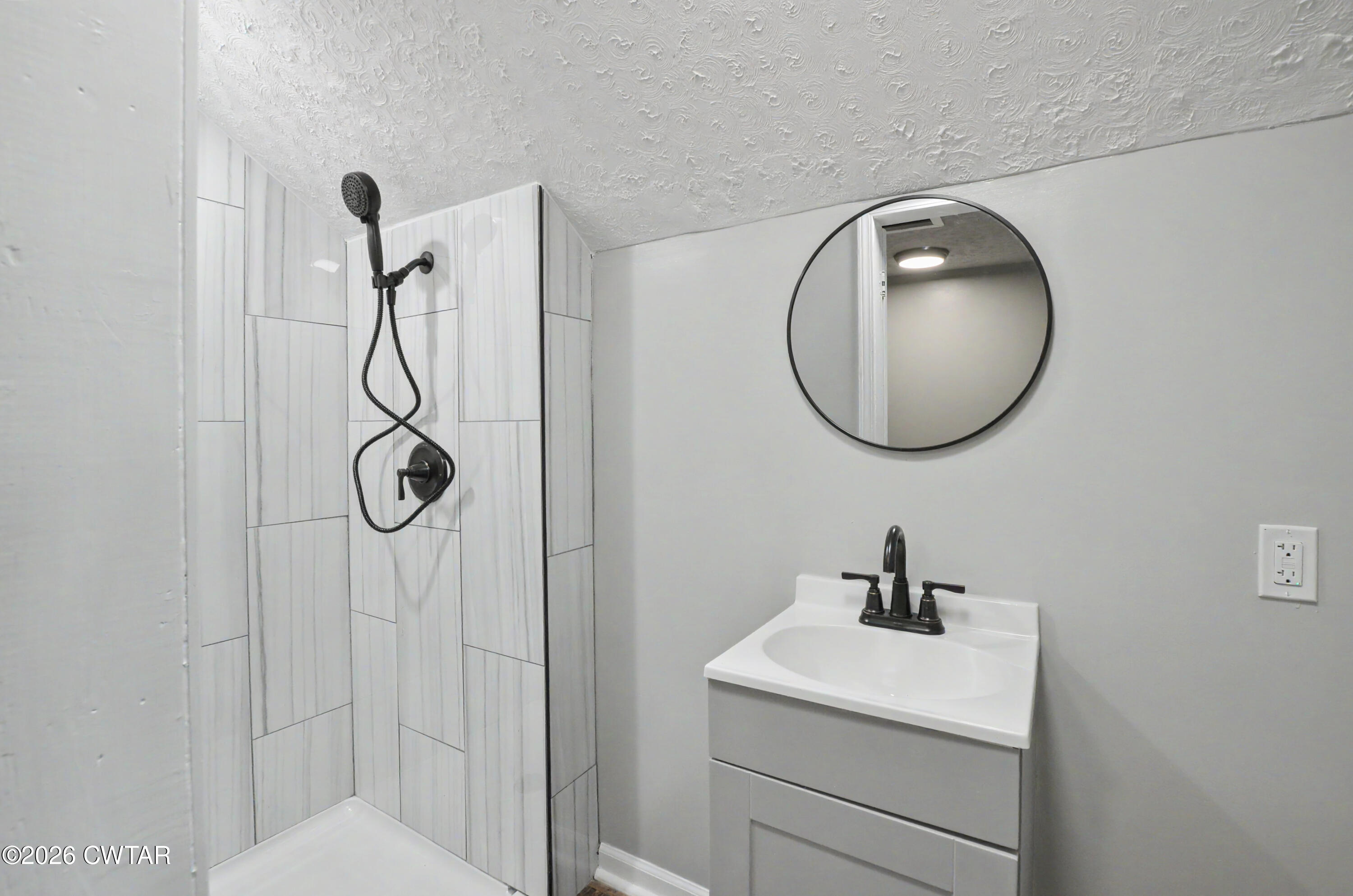 4177 Gum Flat Road Bells, TN 38006 - Photo 28 of 30 a bathroom with a sink mirror and vanity