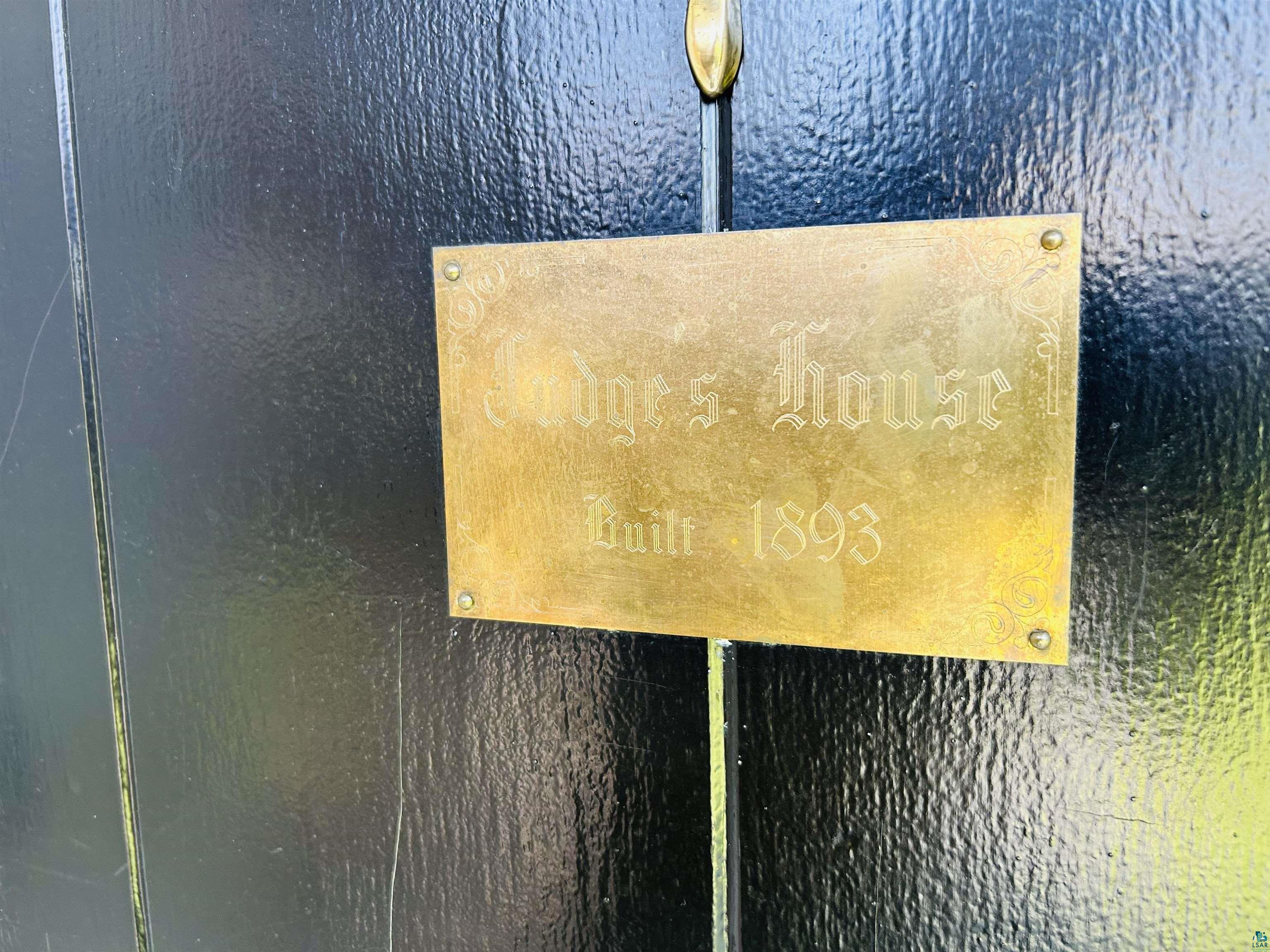 5090 London Road, Unit 1 Duluth, MN 55804 - Photo 6 of 54 Polished brass plaque with engraved text