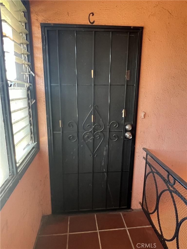 401 West Grand Avenue, Unit C Alhambra, CA 91801 - Photo 3 of 14 a bathroom with a shower and a mirror