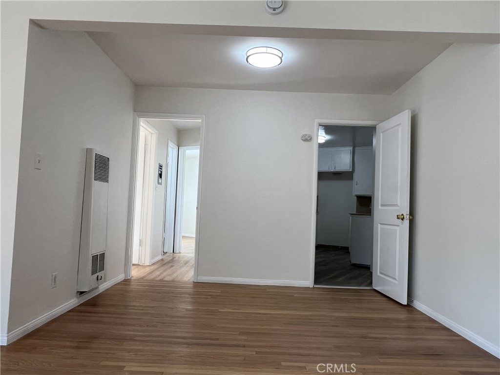 401 West Grand Avenue, Unit C Alhambra, CA 91801 - Photo 6 of 14 a view of an empty room with wooden floor