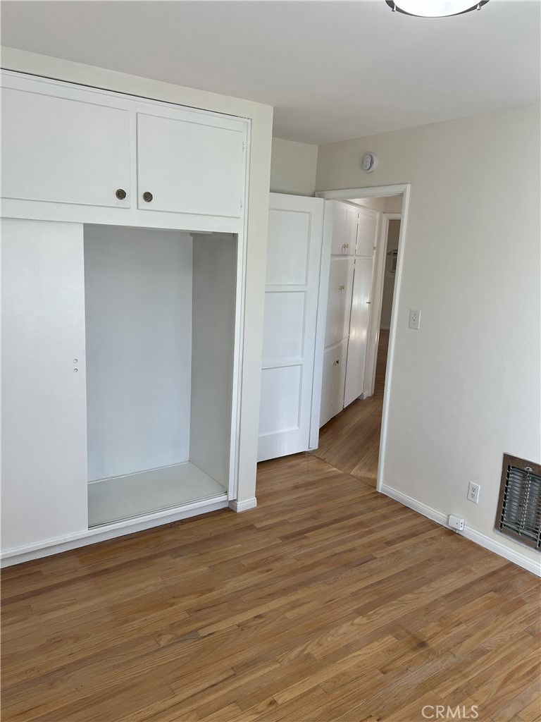 401 West Grand Avenue, Unit C Alhambra, CA 91801 - Photo 10 of 14 a view of an empty room with wooden floor