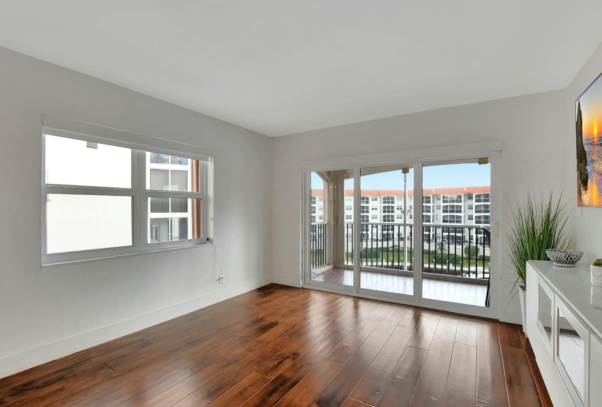 2871 North Ocean Boulevard, Unit V441 Boca Raton, FL 33431 - Photo 11 of 75 a view of wooden floor and windows in a room