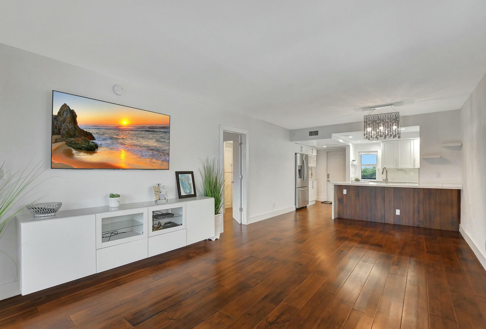 2871 North Ocean Boulevard, Unit V441 Boca Raton, FL 33431 - Photo 12 of 75 a view of kitchen with wooden floor and electronic appliances