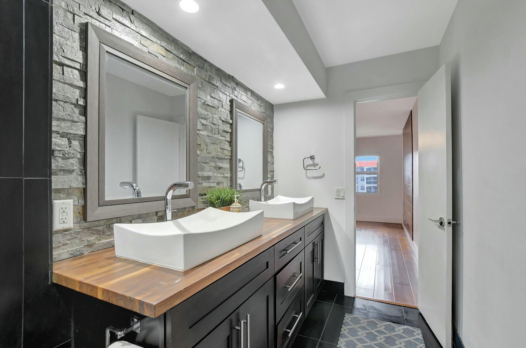 2871 North Ocean Boulevard, Unit V441 Boca Raton, FL 33431 - Photo 20 of 75 a bathroom with a sink and a mirror