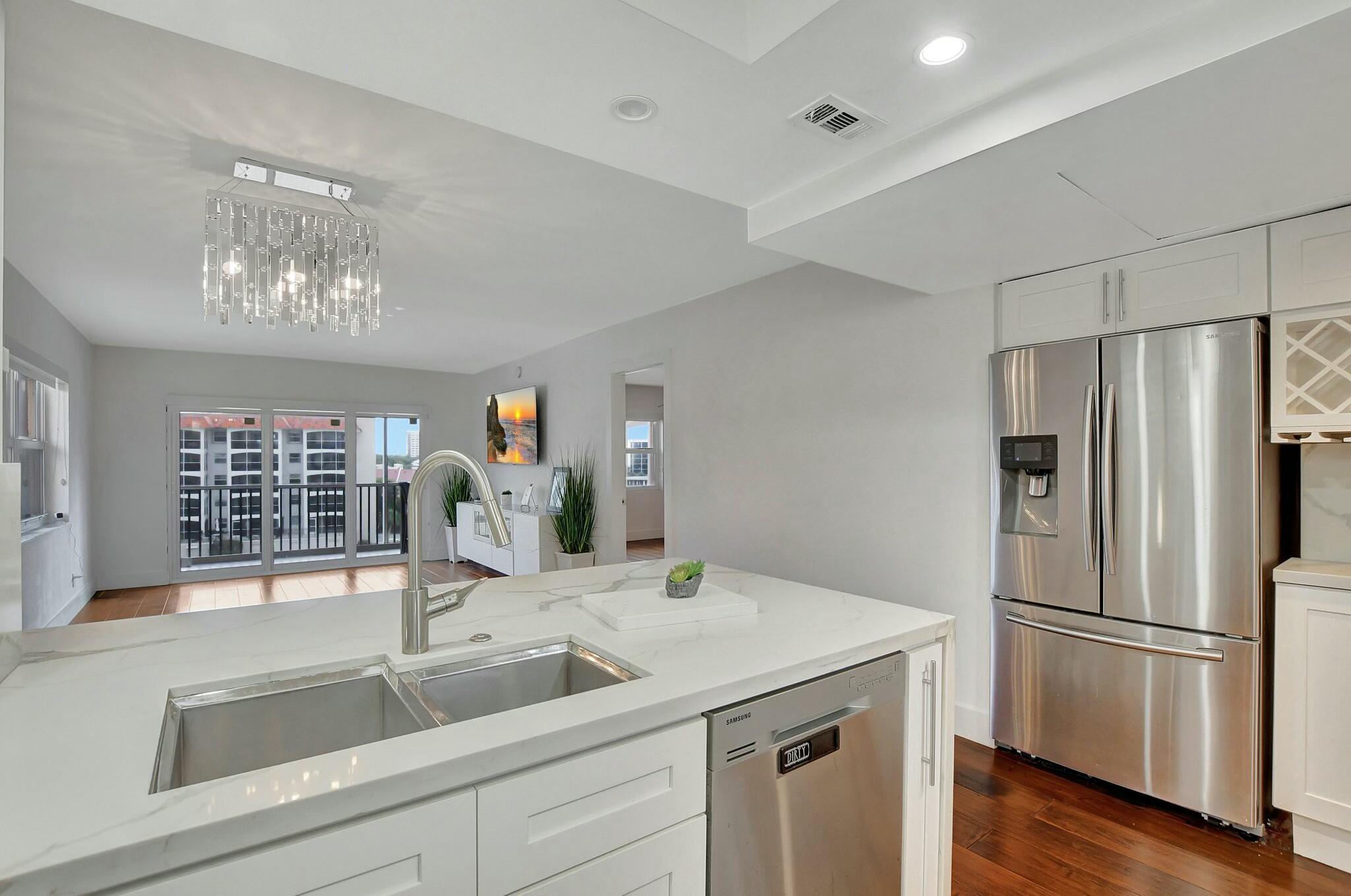 2871 North Ocean Boulevard, Unit V441 Boca Raton, FL 33431 - Photo 3 of 75 a kitchen with a refrigerator and a sink