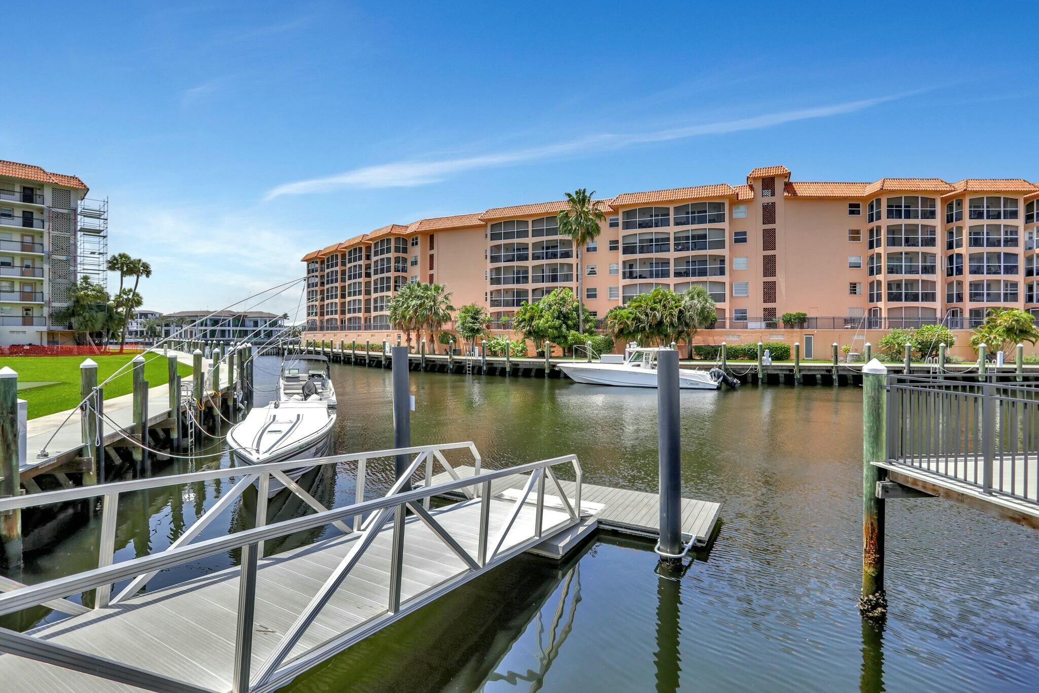 2871 North Ocean Boulevard, Unit V441 Boca Raton, FL 33431 - Photo 50 of 75 a view of a lake with a city skyline in the background