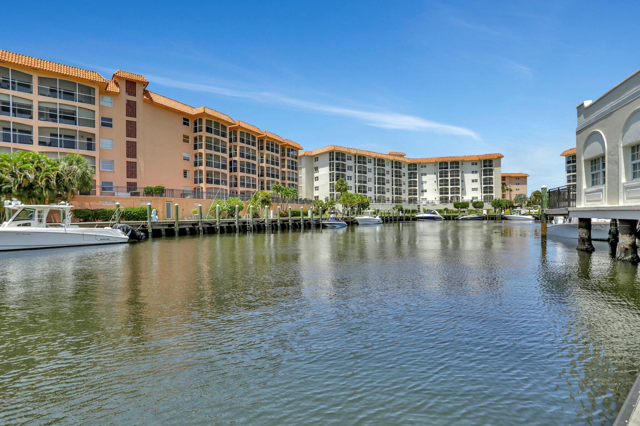 2871 North Ocean Boulevard, Unit V441 Boca Raton, FL 33431 - Photo 51 of 75 a view of a lake with building in front of it
