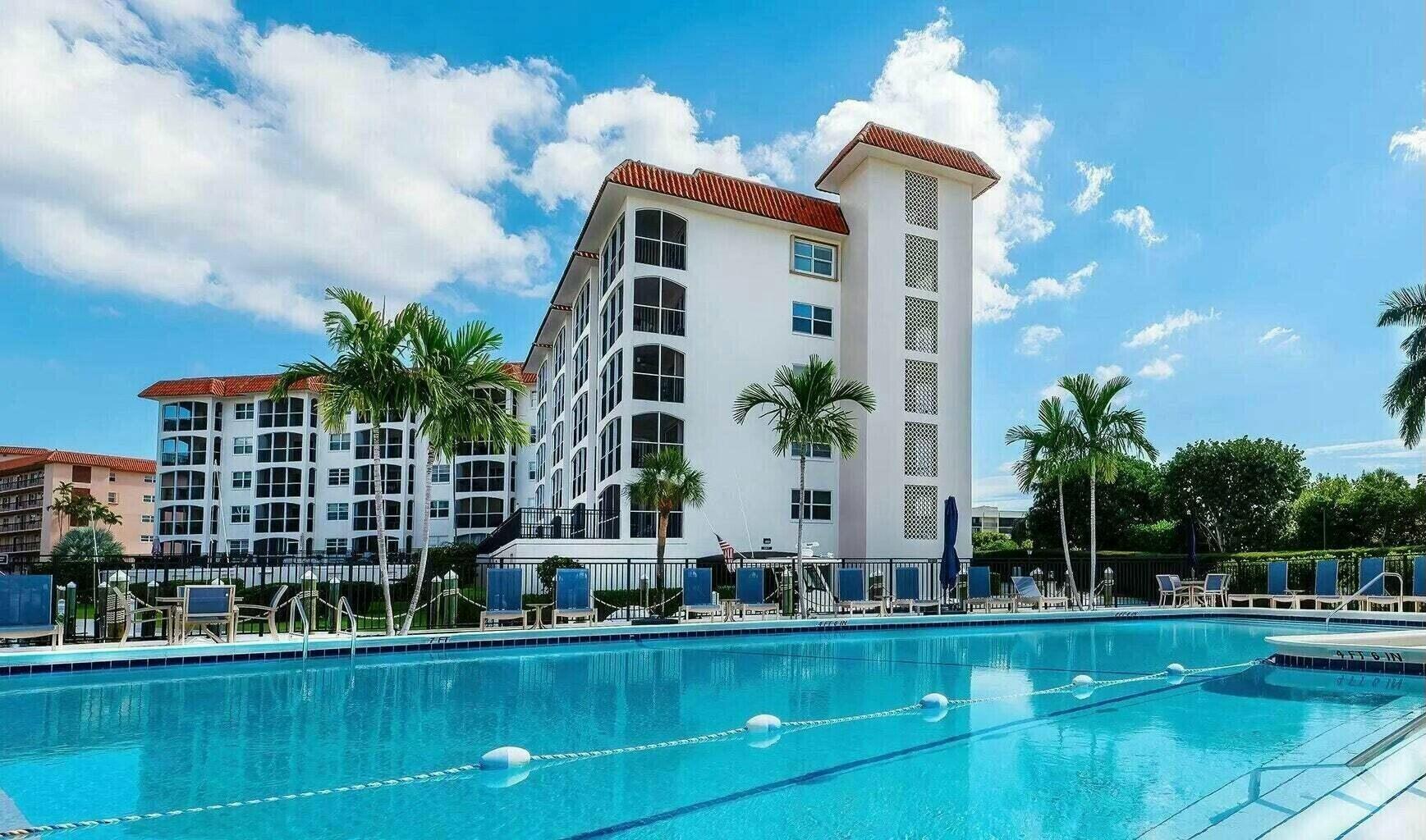 2871 North Ocean Boulevard, Unit V441 Boca Raton, FL 33431 - Photo 59 of 75 a front view of a house with a garden and lake view