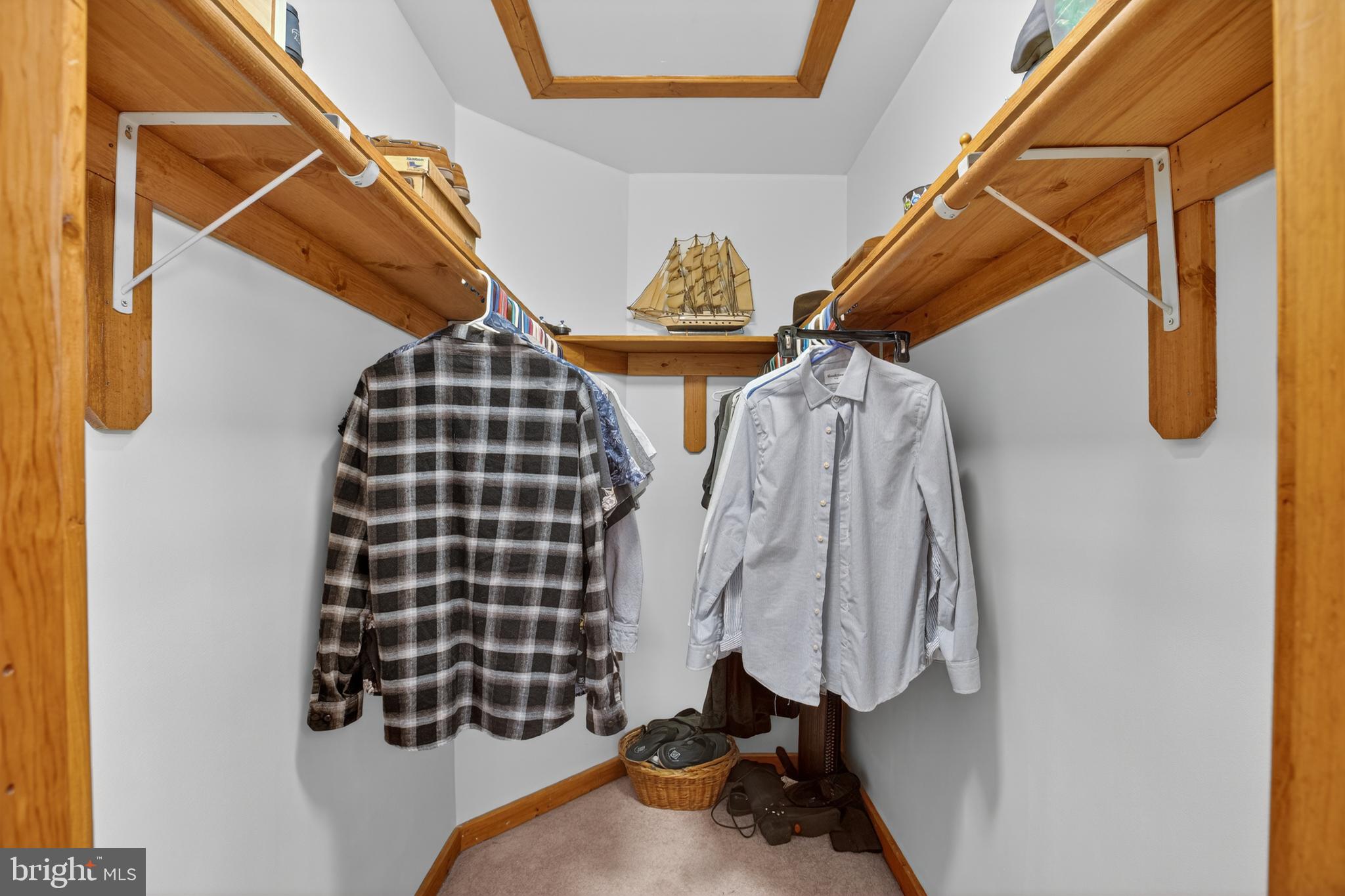 14575 Honeysuckle Way Issue, MD 20645 - Photo 25 of 49 a view of walk in closet with clothes and shoes