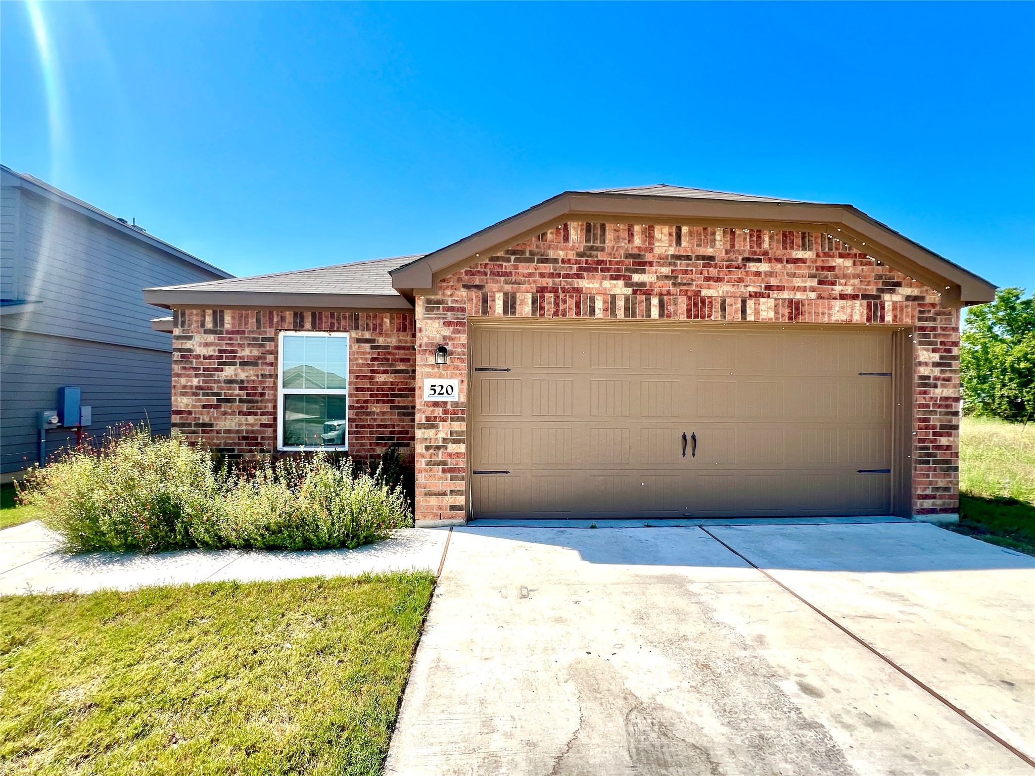 520 Locksley Cove Jarrell, TX 76537 - Photo 24 of 27 A classic brick facade and a two-car garage welcome you home to this inviting residence.