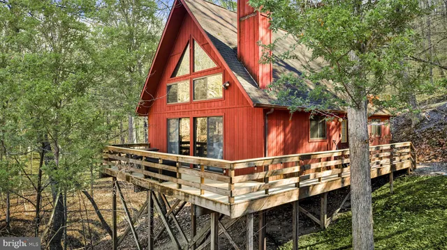 a view of an outdoor sitting area with furniture and stairs