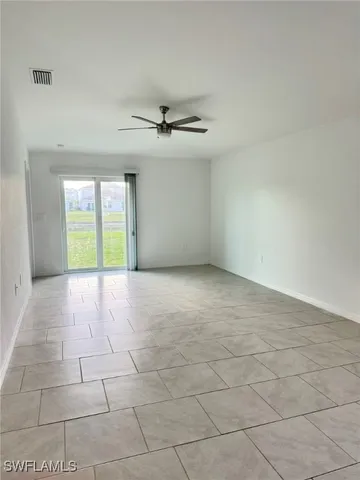 a view of an empty room with a window