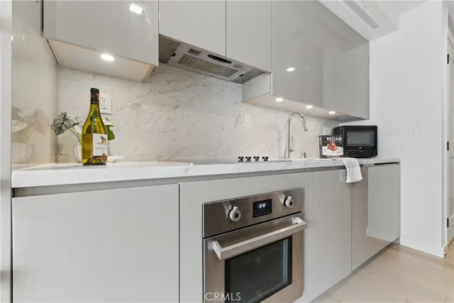 a kitchen with a stove and a microwave