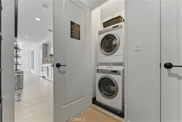 a view of a hallway with washer and dryer