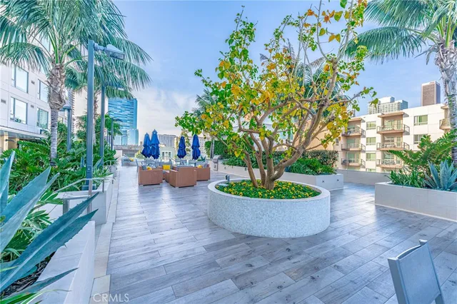 a patio with yard and outdoor seating