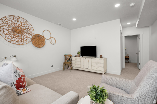 2706 West Maple Street, Unit 285 Mapleton, UT 84664 - Photo 25 of 36 Spacious room featuring neutral carpeting, white painted walls, recessed lighting, and a white baseboard trim