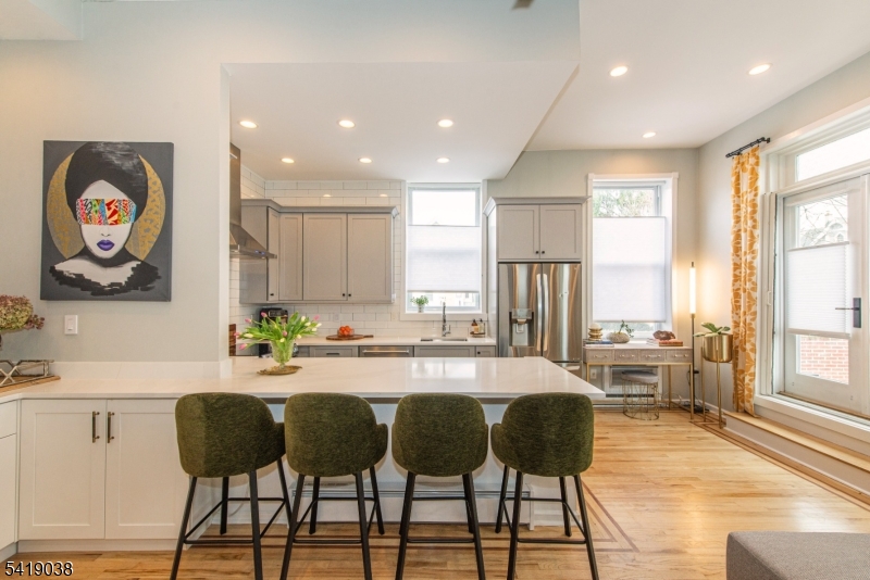 523 Trinity Place Westfield, NJ 07090 - Photo 14 of 33 a kitchen with stainless steel appliances granite countertop a refrigerator and a dining table