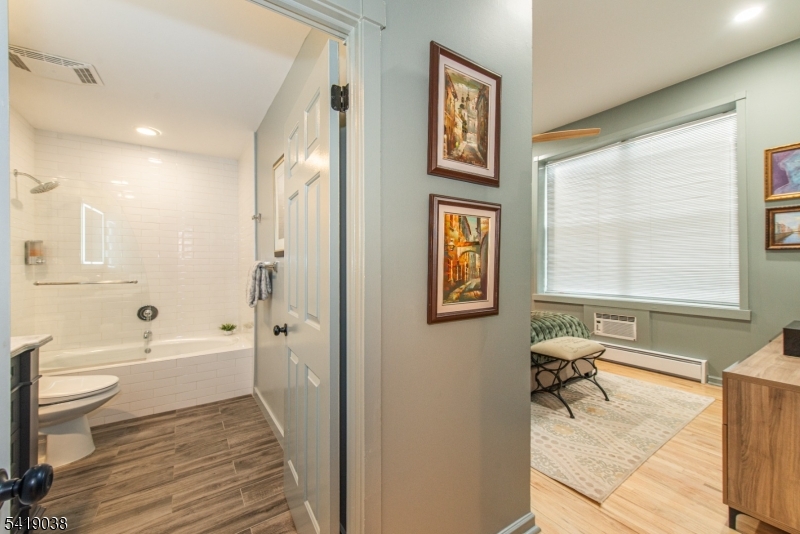 523 Trinity Place Westfield, NJ 07090 - Photo 18 of 33 a bathroom with a toilet a sink and a bathtub