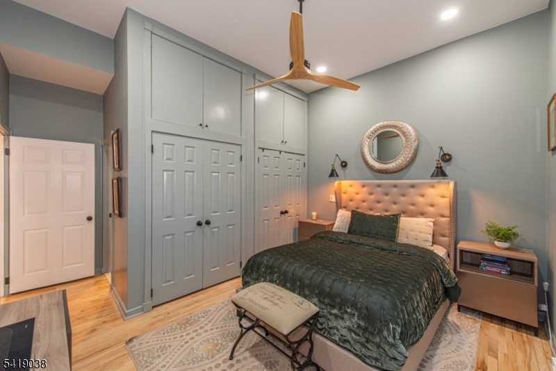 523 Trinity Place Westfield, NJ 07090 - Photo 19 of 33 a bedroom with a bed a dresser and chair