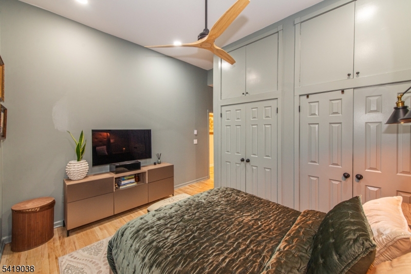 523 Trinity Place Westfield, NJ 07090 - Photo 20 of 33 a bedroom with a bed and a flat screen tv