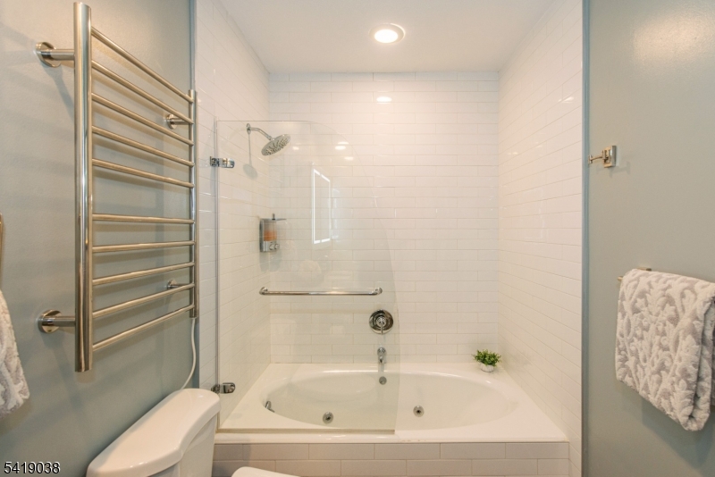 523 Trinity Place Westfield, NJ 07090 - Photo 23 of 33 a bathroom with a bathtub and shower