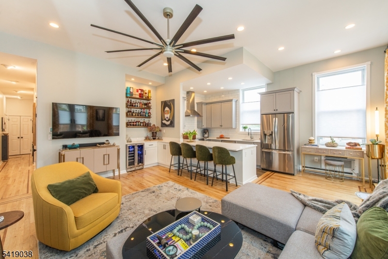 523 Trinity Place Westfield, NJ 07090 - Photo 4 of 33 a living room with furniture kitchen view and a flat screen tv