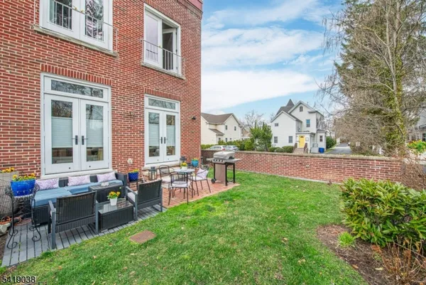 a living room with furniture fireplace and flat screen tv