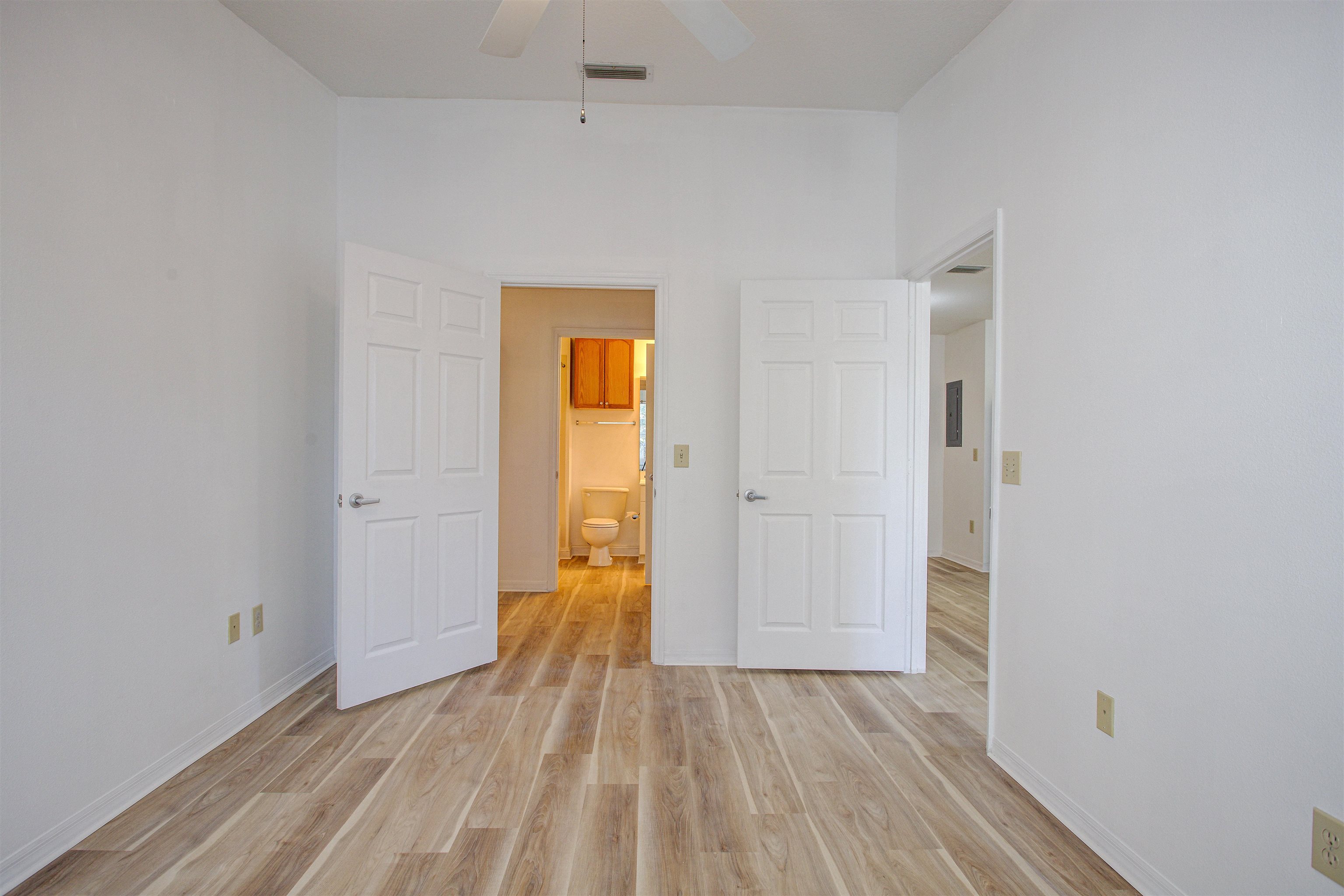15205 Harbour Vista Circle St. Augustine, FL 32080 - Photo 17 of 20 a view of a room with wooden floor and brick walls