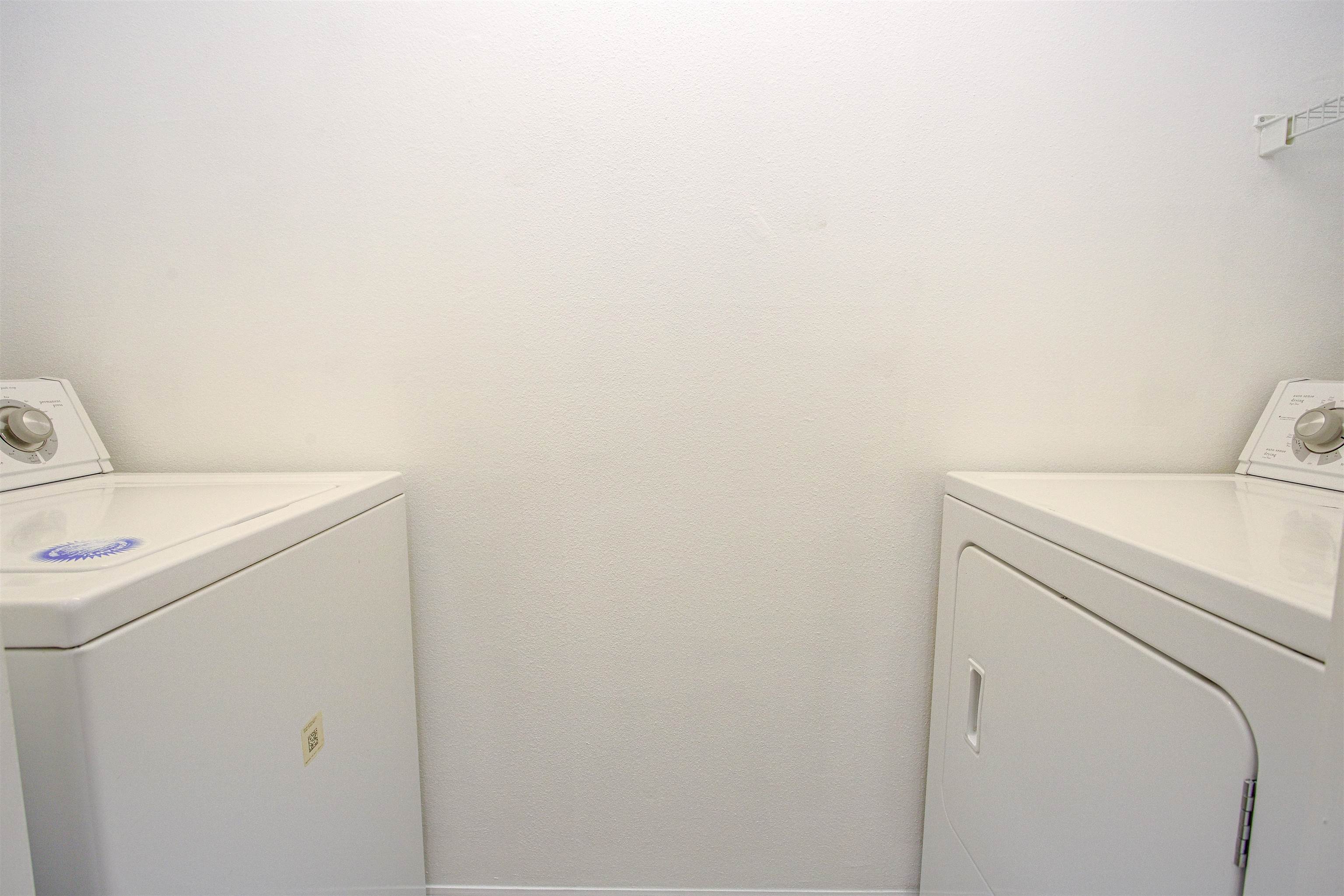 15205 Harbour Vista Circle St. Augustine, FL 32080 - Photo 18 of 20 a utility room with dryer and washer