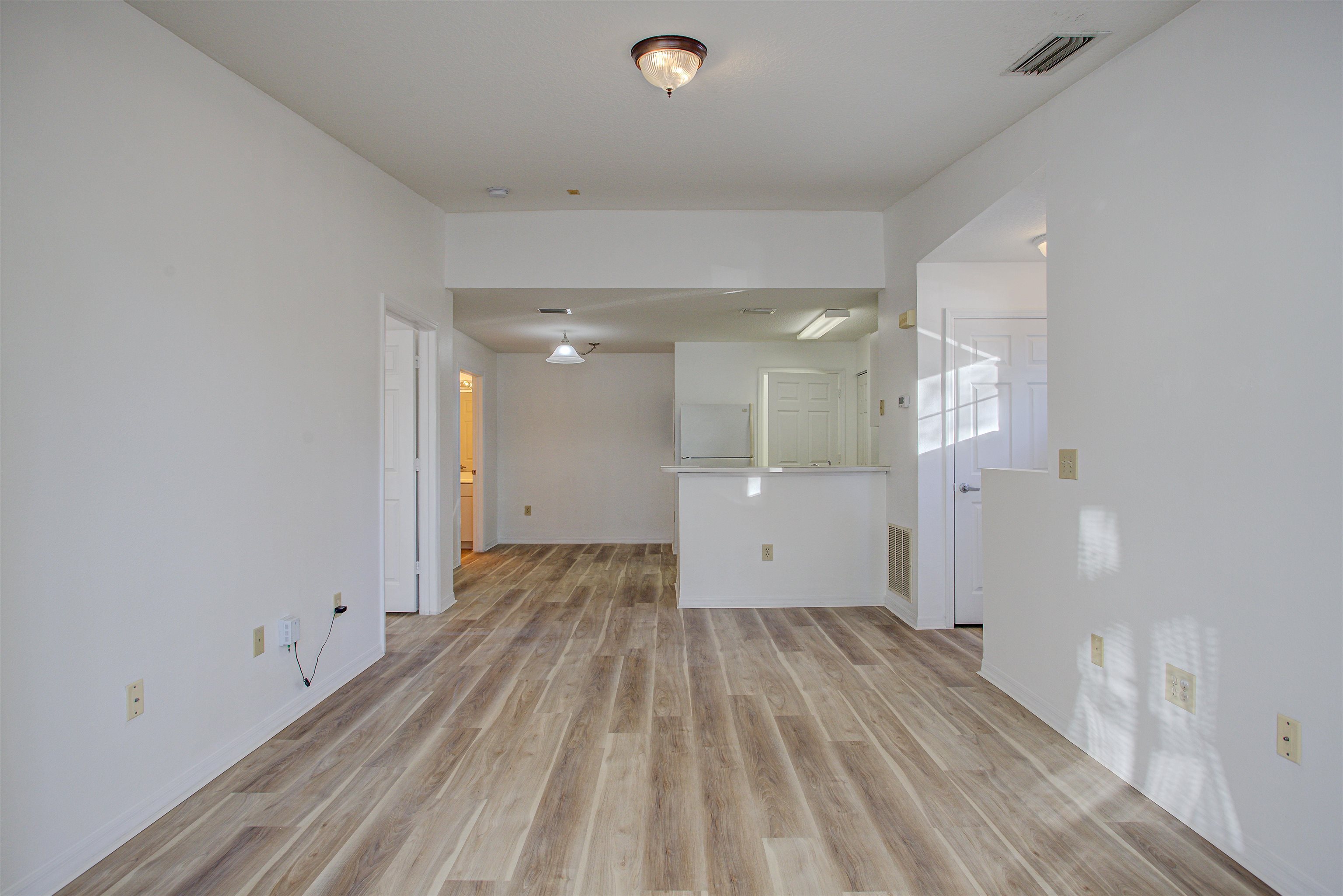 15205 Harbour Vista Circle St. Augustine, FL 32080 - Photo 3 of 20 a view of a room with wooden floor and windows