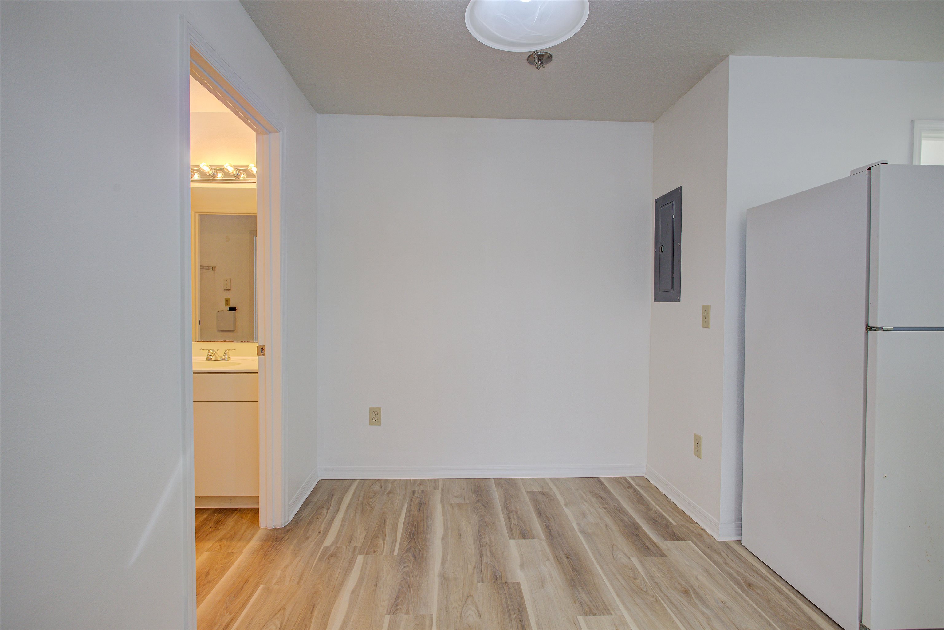 15205 Harbour Vista Circle St. Augustine, FL 32080 - Photo 8 of 20 a view of an empty room with wooden floor and a window