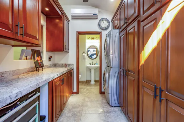 a kitchen with stainless steel appliances granite countertop a refrigerator and a sink