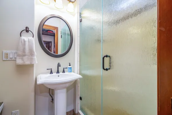 a bathroom with a sink and mirror