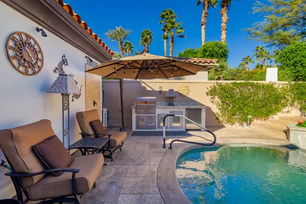 a view of a swimming pool with a patio