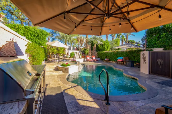 a view of swimming pool with a patio