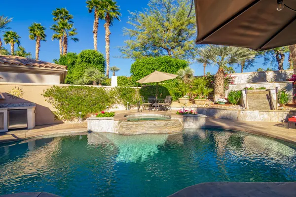 a view of a swimming pool with a patio